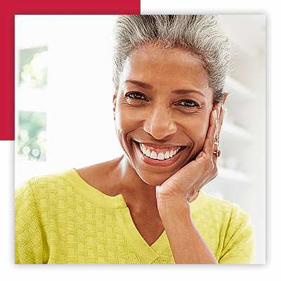Closeup of Woman With Hand On Her Face Smiling